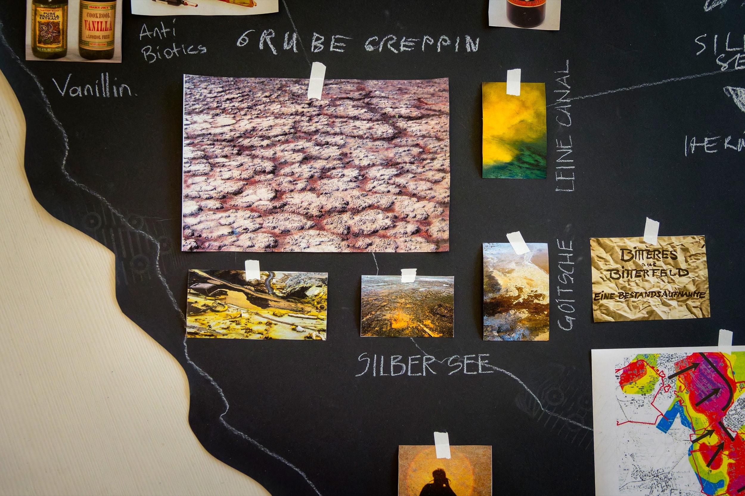 Research moodboard combining photography, handwritten concepts, and material studies on black background